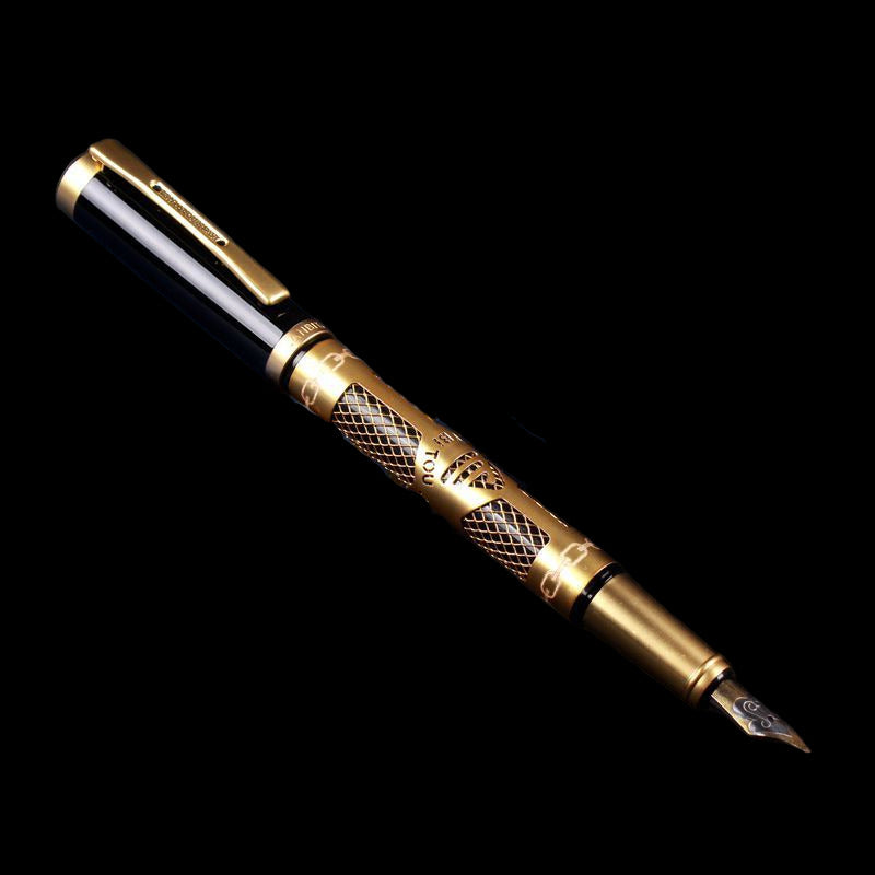 Gold fountain pen against a dark background