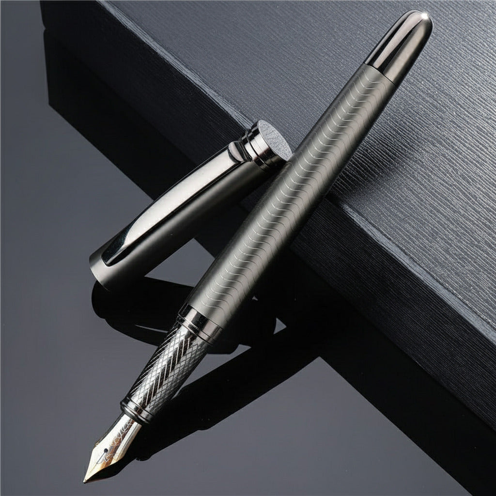 Silver fountain pen on a dark surface