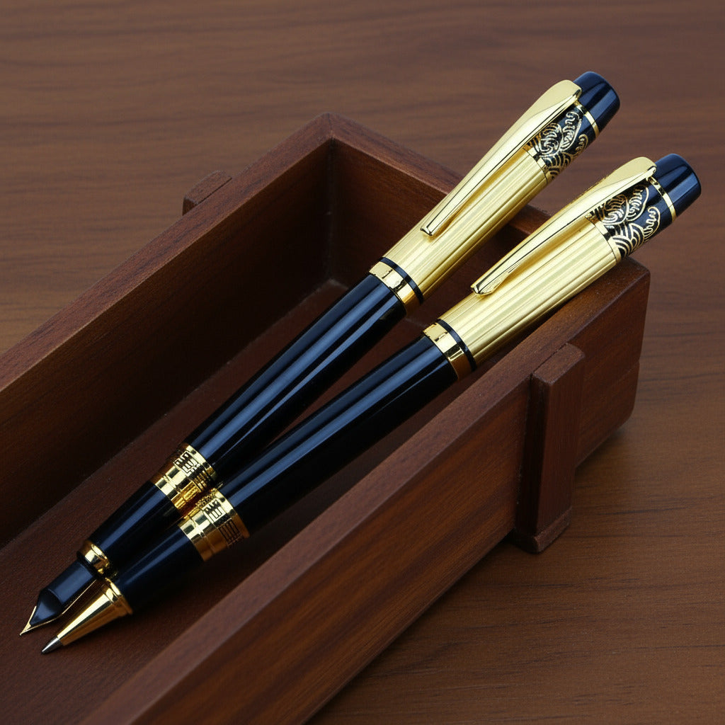 Two black and gold pens in a wooden box
