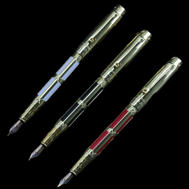 Three ornate pens with intricate designs on a dark background