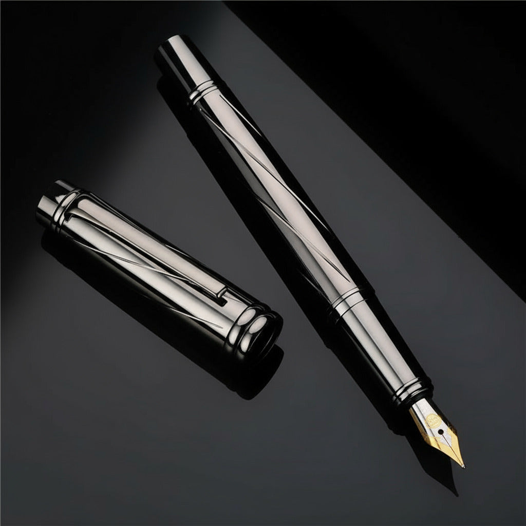 Silver fountain pen on a dark surface