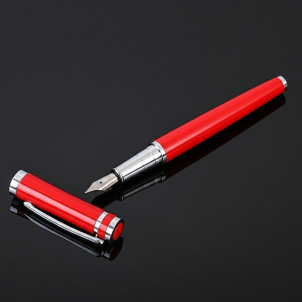 Red fountain pen with silver accents on a black surface